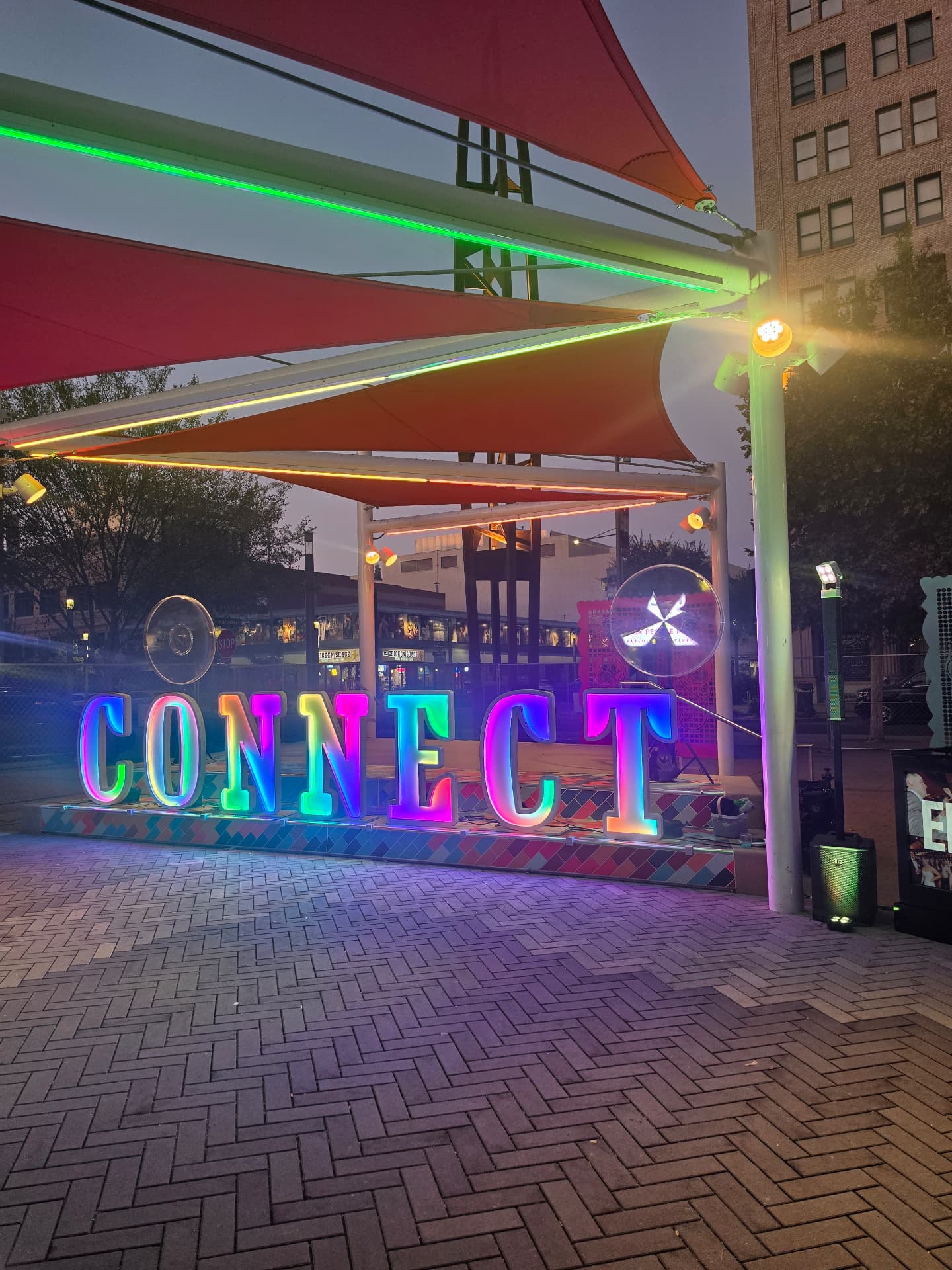 Glowing CONNECT LED letters with hologram fans in downtown Fresno